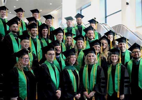 UWS graduates in cap and gown